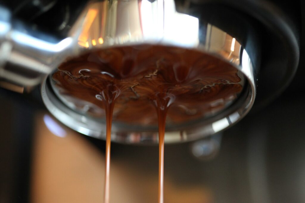 Home Espresso pouring from a portafilter on an espresso machine